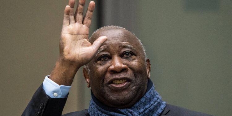 Former Ivory Coast president Laurent Gbagbo greets supporters attending the court session at the International Criminal Court in The Hague, Netherlands, Thursday, Feb. 6, 2020. The ICC hears an appeal by Gbagbo against conditions imposed on him and a former government minister during their release from custody pending prosecutors' appeal against their acquittals on crimes against humanity charges. (AP Photo/Jerry Lampen, Pool)/PDJ107/20037346405284//2002061038